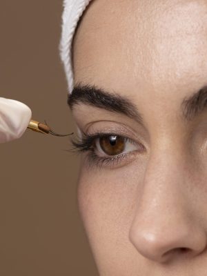 woman-doing-eyelashes-treatment-her-client